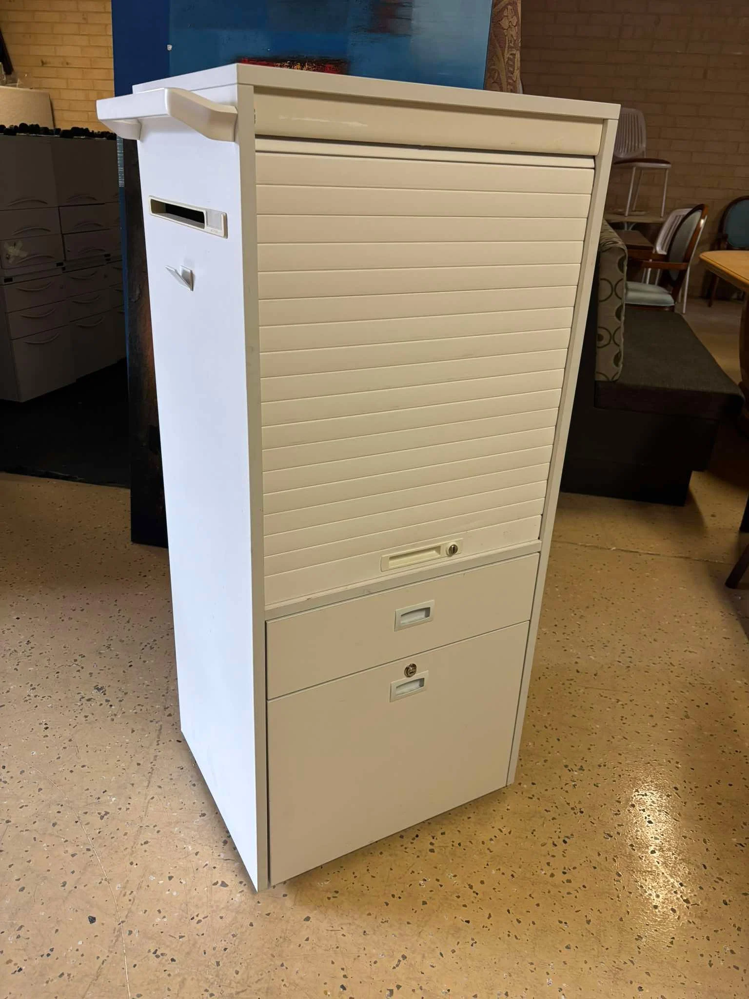 White Metal Roll‐Top Storage Cabinet Price to List: $100 each Quantity: 50+ available